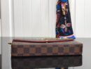 LV pochette brown grid